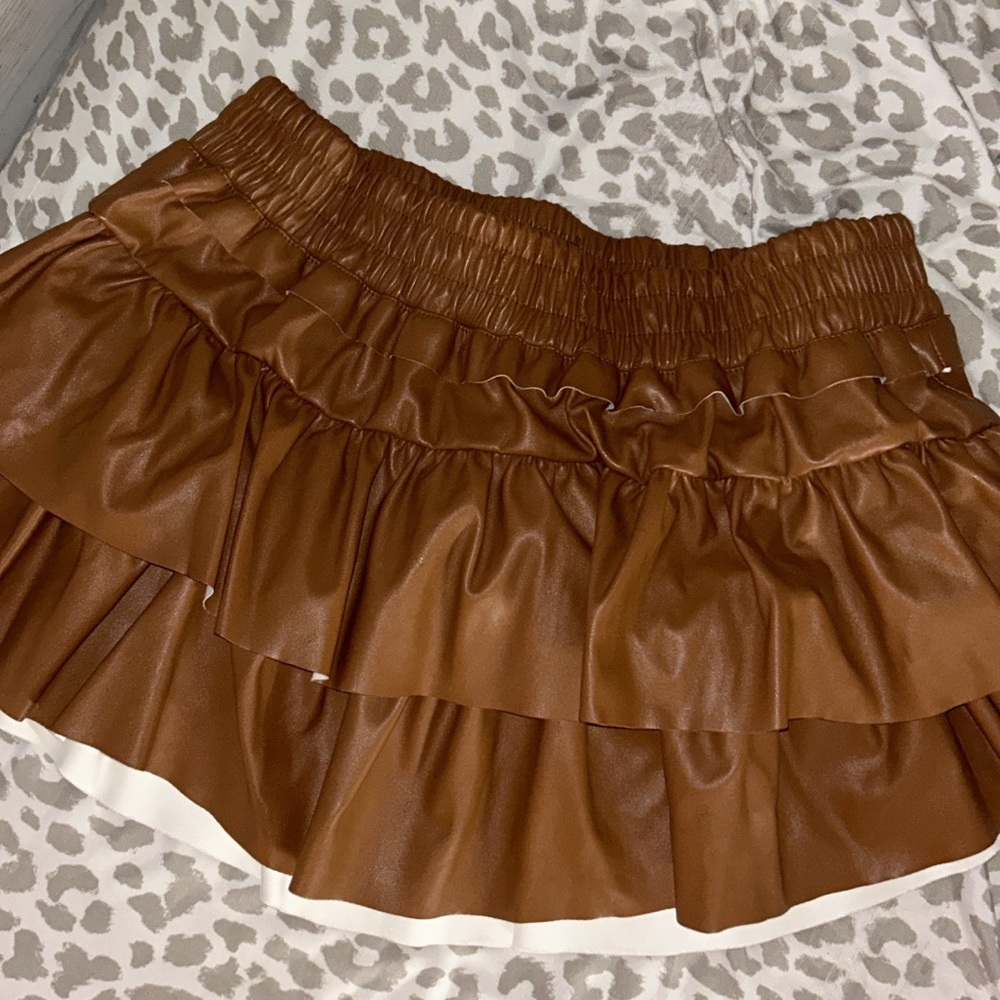 These three boutique - brown leather mini skirt